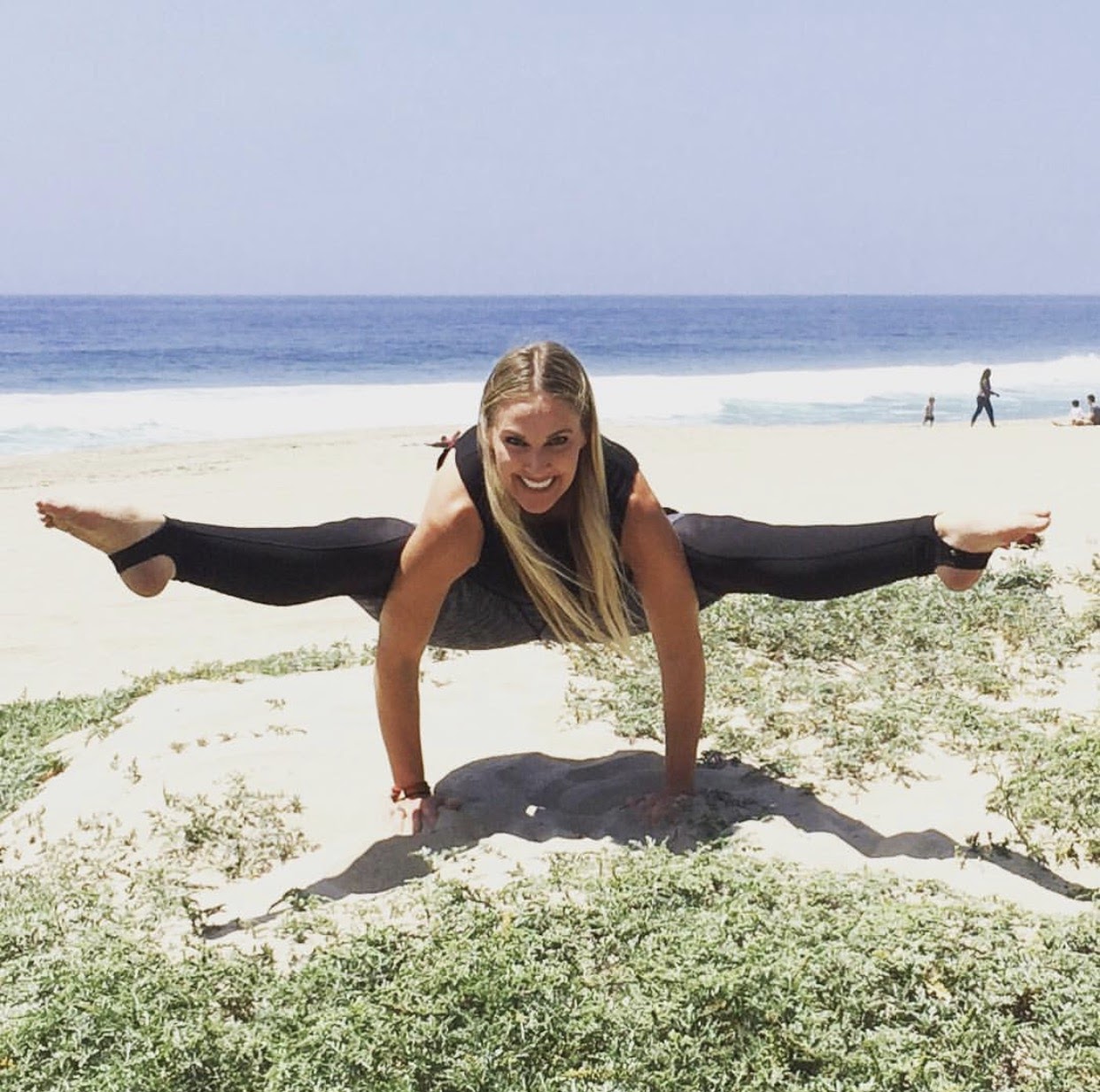 Strong outdoor yoga pose at the beach