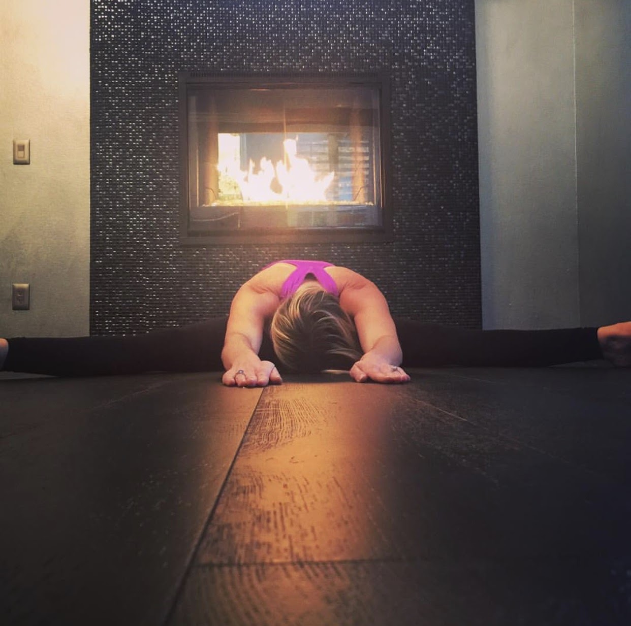 Peaceful yoga pose near a fireplace